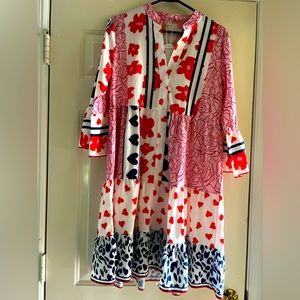 Red white, and blue patterned dress. Says large but will fit size 10 to 12.